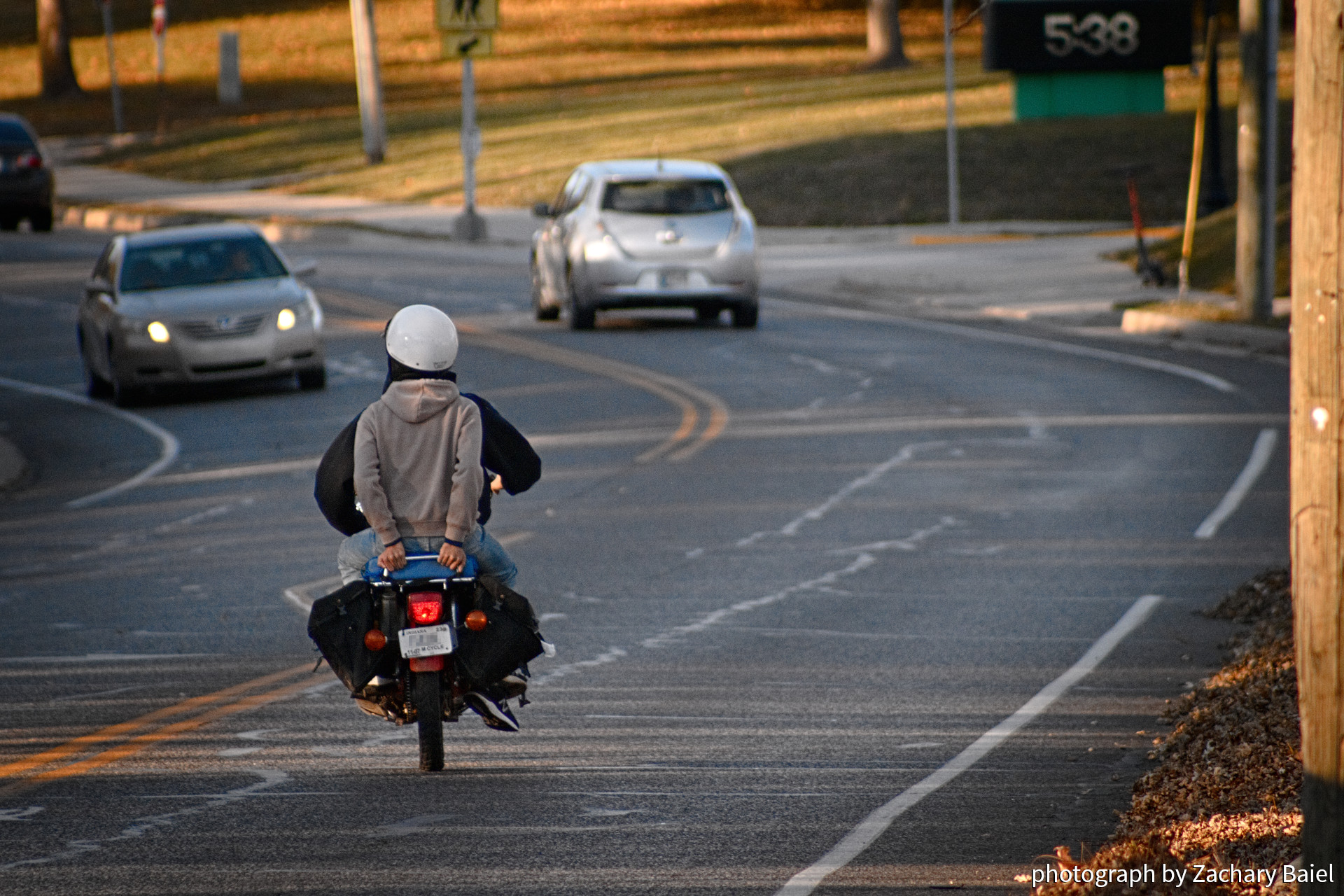Motorcyclist and passenger, autumn evening, on Salisbury St.