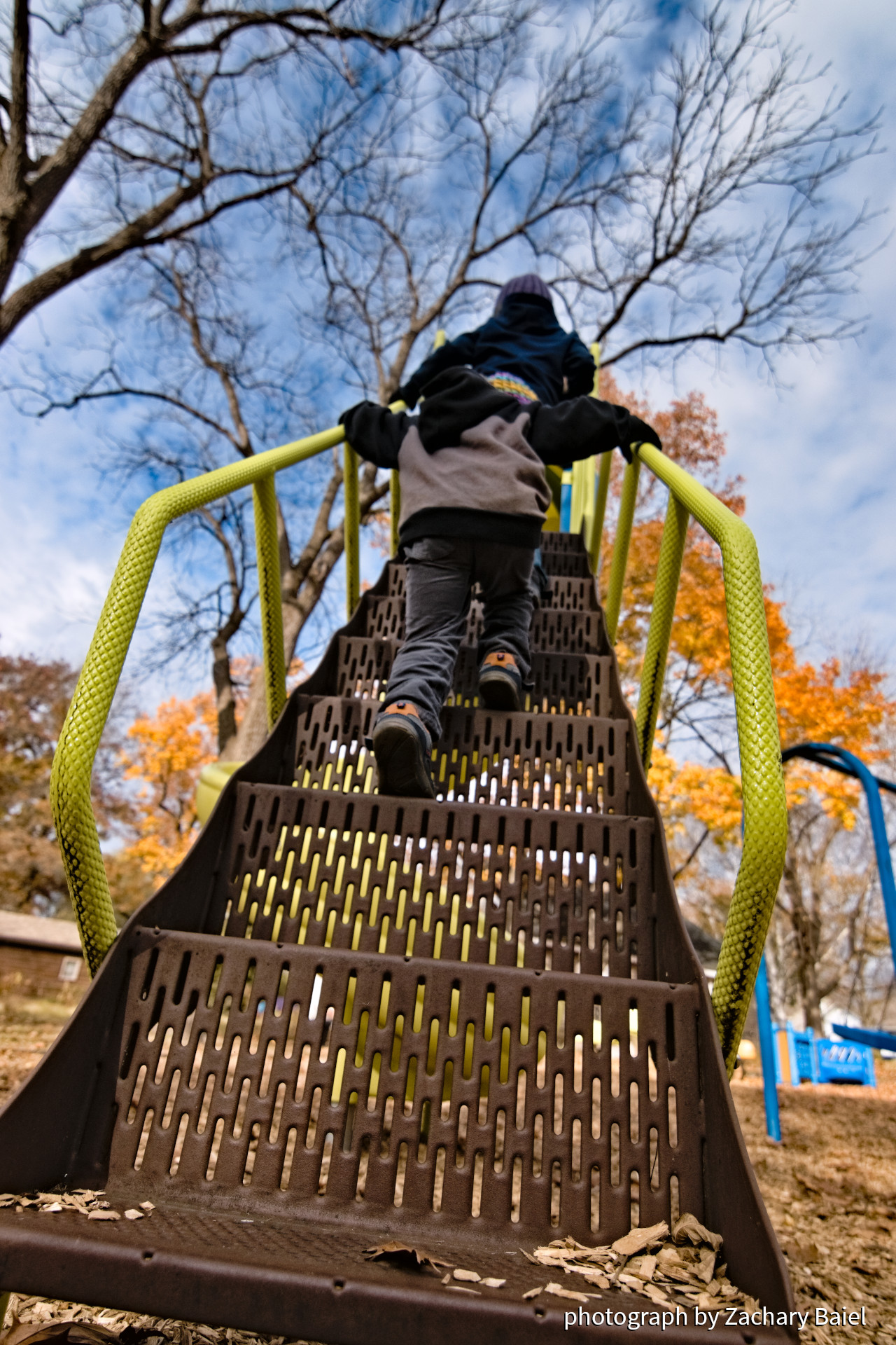 Children on the slide at the Paula R. Woods Park in the New Chauncey neighborhood | October 2022